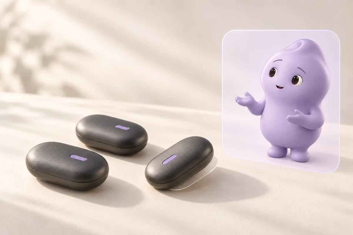 Concept render: three dark, rounded NUUS Core modules with lavender indicator lights on an ivory surface, beside a lavender panel showing Numa gesturing as it explains.